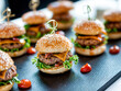 Mini Hamburgers on a black slate for catering