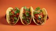 Frontal view of three delicious tacos with vegan meat and coriander  in orange background.