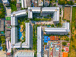 Aerial View condominium swimming pool residential complex among low-rise buildings