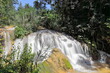 Waterfall of the Rio Melodioso River that forms the Poza el Venado Pool swimming spot on the Centinelas Hike, Guanayara Park. Cienfuegos-Cuba-220