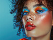 © Synthetica - Young woman fashion model, beautiful with bright color glitter colour beauty creative trendy stylish glow makeup. Face and hair makeover. Portrait. Make up artist ads background. Close up.