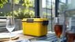 Yellow lunch box on a table in a restaurant terrace with glasses of wine, Generative AI illustrations.