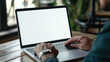 © Synthetica - Business person working online or learning using laptop mock up blank white empty screen, hands typing on computer background close up view. Mockup display for ads. Close up view.