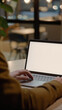 Business person working online or learning using laptop mock up blank white empty screen, hands typing on computer background close up view. Mockup display for ads. Close up view.