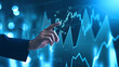 Investing and stock market concept. A businessman touching graph financial data charts for trading forex, stocks, money, and digital assets. business finance, technology, and investment.