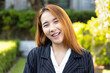happy laughing Asian office worker woman, in smart casual corporate suit