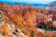 Bryce Canyon National Park in Utah (USA). Giant natural amphitheater panorama on a sunny winter morning. Colorful “Hoodoo“ structures, formed by frost and stream erosion. Attraction in warm light.