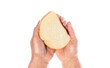 Old woman's hand holding piece of bread. Hand with slice of whole wheat bread. Helping the homeless. Slice of bread in old wrinkled hands against white background, close-up