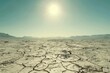 a desert with cracked ground, bright sun in the sky