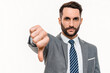 Serious businessman banning showing thumb down isolated over white background. Sad dissatisfied Caucasian manager with disagree dislike forbidden failed gesture