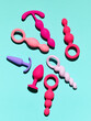 sex toys background. anal plugs and dildo over blue backdrop