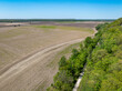 KATY biking trail running along the edge of a wide valley of the Missouri Rive, near WIlton, MO, springtime aerial view