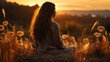 Une femme méditant dans la nature au coucher du soleil, la silhouette de la jeune fille assise sur ses genoux et regardant au loin