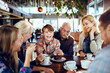 © Davor - Multigenerational family enjoying time at a cafe
