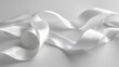 the timeless beauty of a white ribbon on a white background, capturing its graceful curves and soft textures.