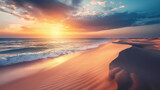 Fototapeta Niebo - The Setting Sun Casts A Spectacular Glow Over The Seaside Sand Dunes