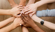 © Eggy - People gather hands for Teamwork - Yelling out a Motivational Shout before taking Action - Different Ethnicity group of People working Together