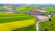 Curvy countryside road in Ponidzie region of Poland. Aerial drone view