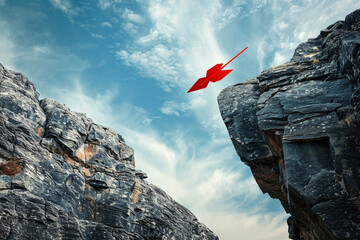 A red arrow leaping over a gap between cliffs, showcasing risk-taking and the leap of faith required to overcome fears 