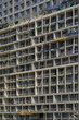 Facade of a tall building under construction. Abstract construction background.