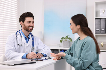 Sticker - Doctor consulting patient during appointment in clinic