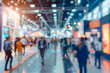 © Visual Craft - A busy expo hall with people walking around, defocused, blurred background