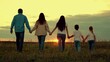 Parents, children are walking in park at sunset. Big Family walks on green grass in meadow in spring. Happy family, child, walk through summer field holding hands. Mom dad daughter together, nature.