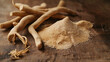Dried aswagandha powder and whole root on a table. Herbal medicine.