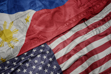 Poster - waving colorful flag of united states of america and national flag of philippines on the dollar money background. finance concept.