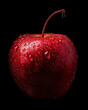 Close up of a fresh red apple with water droplets on a dark background
