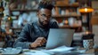 © Maquette Pro - Diligent individual focused on completing tasks at sleek desk