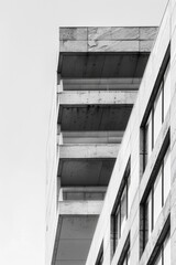 Canvas Print - A striking black and white image of a tall building. Perfect for architectural and urban design projects