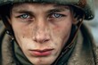 Intense blue-eyed young soldier in close-up portrait, conveying deep contemplation or sadness, against a blurred natural backdrop, capturing the emotional toll of military service