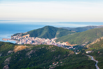 Wall Mural - Panoramic view of Budva city from the mountain in Montenegro. Coastal town and mountains view from above