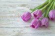 Beautiful Purple Tulips on a Light Wooden Board with Space for Copy, Mothers Day