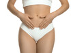 © New Africa - Gynecology. Woman in underwear on white background, closeup