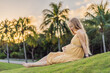 pregnant woman finds joy and serenity, relishing a tranquil moment outdoors during her pregnancy journey