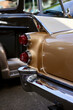 closeup detail on the tail fin and tail lights of a vintage car
