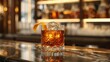 An elegant whiskey cocktail, perhaps an Old Fashioned, garnished with a twist of orange peel, served on a classic bar counter with vintage ambiance