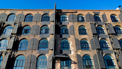 brick building with vintage windows in new york city