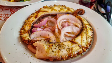 Octopus prepared the Greek way with onions and olive oil in luxury authentic gourmet restaurant in Thessaloniki, Central Macedonia, Greece, Europe. Octopus salad. Mediterranean cuisine delicacies