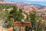 Fototapeta Góry - Wooden sign saying Bryce Canyon Wilderness Area at the start of the Fairyland Trail in the Amphitheatre, Bryce Canyon National Park, Utah, USA. Selective focus on informational sign