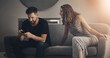 © peopleimages.com - Couple, phone and spy for relationship, cheating and trust with toxic partner in house on sofa. Man, smartphone and peep for affair, jealous and jealous with paranoid girlfriend in home on couch