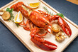 Grilled Lobster with Cheese on wooden plate, Grilled Canadian Lobster on wooden background.