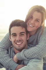 Happy couple, portrait and outdoor piggyback for playful date, relationship or anniversary. Man, woman and face with smile in Australia for holiday winter with fun bonding, connection or traveling