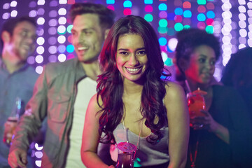 Wall Mural - Portrait, smile and woman, nightclub and party with friends, happy and celebration for birthday, confidence and fun. Bokeh, group and lights for new year, weekend and countdown in rave with energy