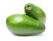 Two ripe ettinger avocados with vibrant green skin, isolated on a white background. Real photo