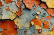 A colorful, cracked wall with yellow, blue, and red splatters