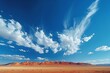 Beautiful cirrus clouds over a vast desert landscape