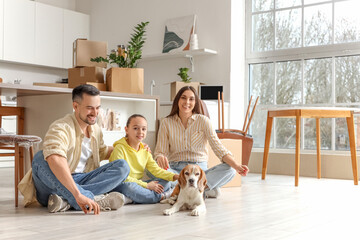 Sticker - Happy family with Beagle dog sitting in kitchen on moving day